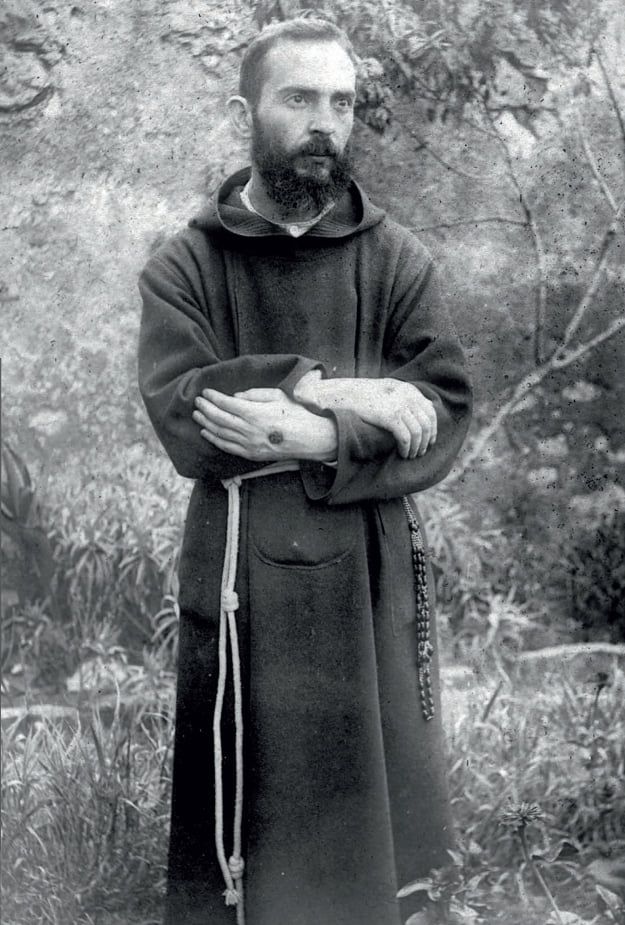 A young Padre Pio showing the stigmata (photo from August 19, 1919)